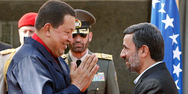 Oct. 19: Venezuelan President Hugo Chavez, left, is welcomed by his Iranian counterpart Mahmoud Ahmadinejad in Tehran.