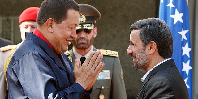 Oct. 19: Venezuelan President Hugo Chavez, left, is welcomed by his Iranian counterpart Mahmoud Ahmadinejad in Tehran.