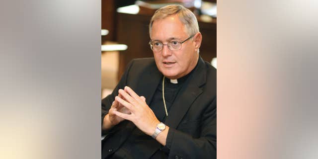 FILE - In this Aug. 21, 2008 file photo, Bishop Thomas Tobin speaks during an interview in his office in Providence, R.I. In an essay published Tuesday, May 10, 2016, Tobin wrote his opposition to legalizing marijuana in the state. (AP Photo/Stew Milne, File)
