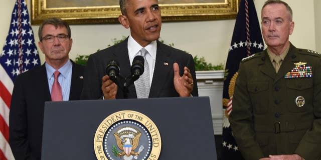President Barack Obama, flanked by Defense Secretary Ash Carter, left, and Joint Chiefs Chairman Gen. Joseph Dunford, makes a statement on Afghanistan from the Roosevelt Room of the White House in Washington, Wednesday, July 6, 2016. The president said the U.S. will leave 8,400 troops in Afghanistan when he completes his term, down slightly from the current number but well up from the 5,500 he announced previously, arguing America's interests depend on helping Afghanistan's struggling government fight continuing threats from the Taliban and others. (AP Photo/Susan Walsh)