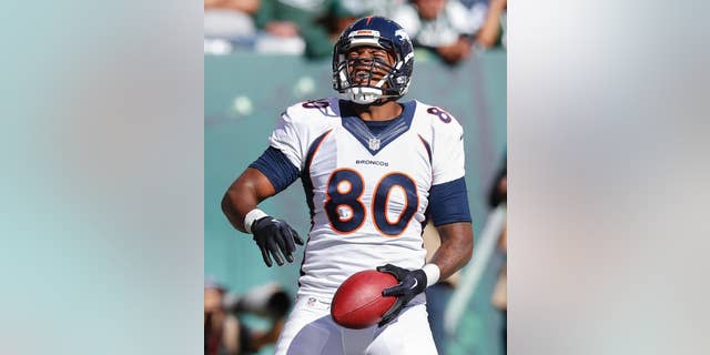 Denver Broncos tight end Julius Thomas (80) reacts after scoring a touchdown against the New York Jets during the third quarter of an NFL football game, Sunday, Oct. 12, 2014, in East Rutherford, N.J. (AP Photo/Kathy Willens)