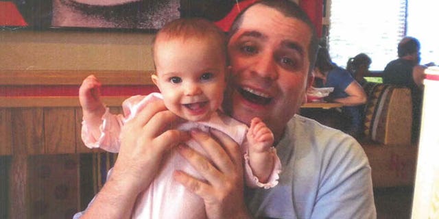 March 12, 2013: This undated file photo submitted into evidence by defense attorney Julia L. Gatto shows New York City police Officer Gilberto Valle with his daughter. Valle, accused of plotting to kidnap, cook and eat women _ including his wife _ was convicted of conspiracy.