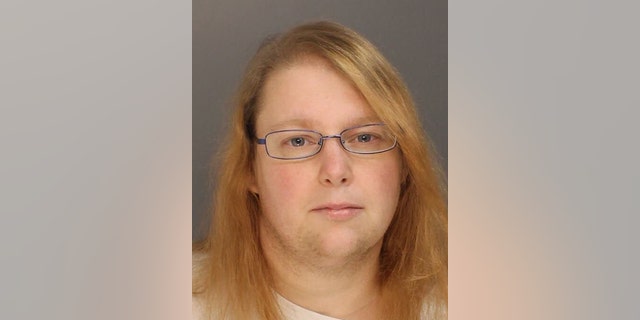 FILE - This photo provided on Sunday, Jan. 8, 2017, by the Bucks County District Attorney shows Sara Packer, whose teenage daughter's dismembered remains were found in the woods last fall. She has been charged along with her boyfriend, Jacob Sullivan, with killing the girl in a "rape-murder fantasy" the couple shared, a prosecutor said. (Bucks County District Attorney via AP)