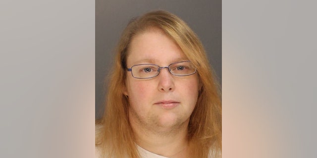 FILE - This photo provided on Sunday, Jan. 8, 2017, by the Bucks County District Attorney shows Sara Packer, whose teenage daughter's dismembered remains were found in the woods last fall. She has been charged along with her boyfriend, Jacob Sullivan, with killing the girl in a "rape-murder fantasy" the couple shared, a prosecutor said. (Bucks County District Attorney via AP)