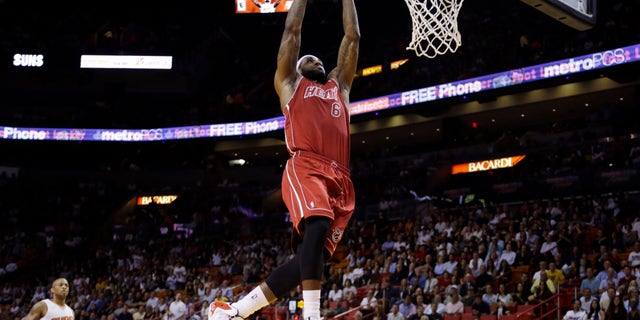 Miami Heat's LeBron James (6) shoots during the first half of an NBA basketball game against the Phoenix Suns, Monday, Nov. 25, 2013, in Miami. (AP Photo/Lynne Sladky)