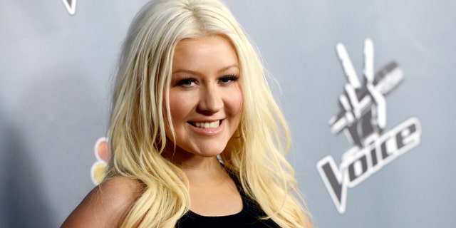 Singer Christina Aguilera arrives at a screening of NBC's "The Voice" Season 4 at the Chinese Theatre on March 20, 2013 in Los Angeles, California. (Photo by Kevin Winter/Getty Images)