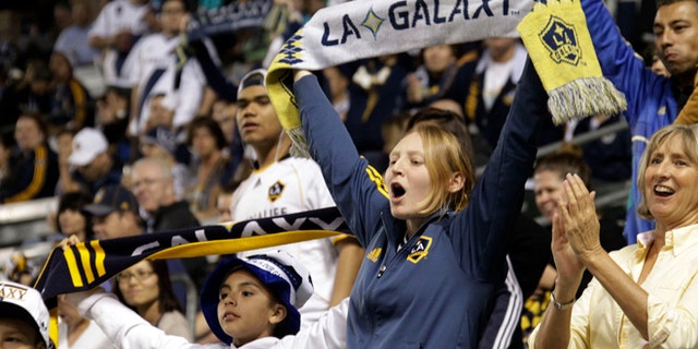 March 8, 2014: Los Angeles Galaxy fans cheer before a game against Real Salt Lake in an MLS soccer game in Carson, Calif. (AP/Reed Saxon)