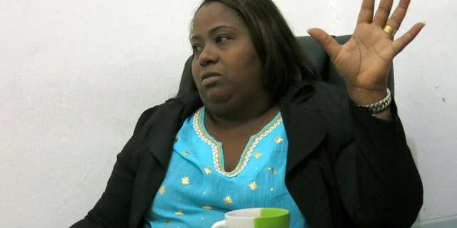In this Tuesday, June 29, 2016 photo, Jacqueline Montero explains the draft bills she's planning to place to protect sex workers' rights, at her office in Santo Domingo, Dominican Republic. Montero is the first former sex worker who won a seat at the Dominican lower chamber and she will take office next August 16th. (AP Photo.Ezequiel Lopez)