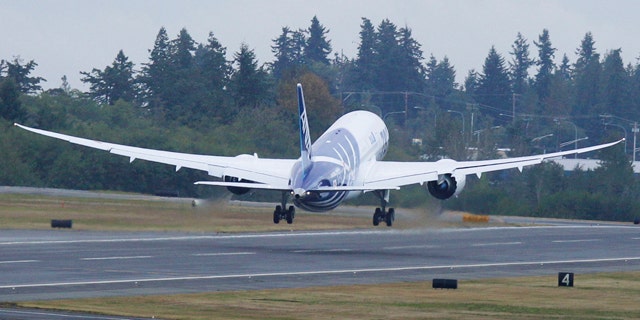 The first Boeing Co. 787 plane delivered to a commercial customer takes off for Japan, Tuesday, Sept. 27, 2011, in Everett, Wash. The plane will be operated by Japan's All Nippon Airways.