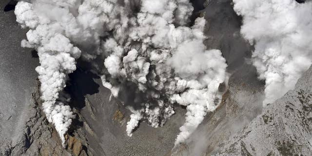 Sept. 27, 2014: Dense fumes are spewed out from several spots on the slope of Mt. Ontake as the volcano erupts in central Japan.