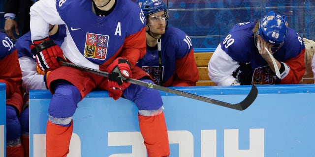 Czech Republic forward Jaromir Jagr sits on the boards waiting to enter the game during the third period of men's quarterfinal hockey game against the United States in Shayba Arena at the 2014 Winter Olympics, Wednesday, Feb. 19, 2014, in Sochi, Russia. (AP Photo/David J. Phillip )