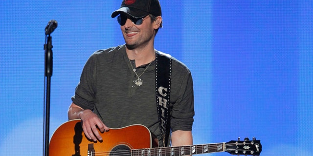 Singer Eric Church smiles after performing "Springsteen" at the 47th annual Academy of Country Music Awards in Las Vegas, Nevada, April 1, 2012.