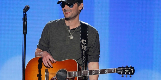 Singer Eric Church smiles after performing "Springsteen" at the 47th annual Academy of Country Music Awards in Las Vegas, Nevada, April 1, 2012.