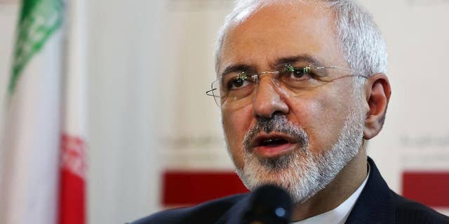 FILE - A Wednesday, Aug. 12, 2015 photo from files showing Iranian Foreign Minister Mohammad Javad Zarif, during a press conference at the Lebanese foreign ministry in Beirut, Lebanon. An unusual secret agreement with a U.N. agency will allow Iran to use its own experts to inspect a site allegedly used to develop nuclear arms, according to a document seen by The Associated Press. (AP Photo/Bilal Hussein, File)