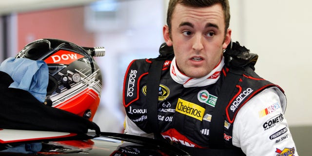Austin Dillon climbs into his car before practice for Sunday's NASCAR Daytona 500 Sprint Cup Series auto race at Daytona International Speedway in Daytona Beach, Fla., Wednesday, Feb. 19, 2014. (AP Photo/Terry Renna)