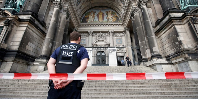 Police opened fire Sunday at a man who was rampaging near Berlin's cathedral, wounding him in the legs.