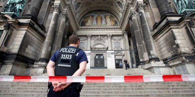 Police opened fire Sunday at a man who was rampaging near Berlin's cathedral, wounding him in the legs.