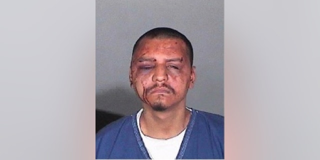 This undated evidence photo provided by the U.S. Attorney's Office shows a mug shot of Gabriel Carrillo taken by the Los Angeles County Sheriff's Department. Two Los Angeles County sheriff's deputies and a sergeant were found guilty Wednesday, June 25, 2015, in the backroom beating of Carrillo, a jail visitor who fellow guards testified already was handcuffed on the ground and covered in blood. Sgt. Eric Gonzalez and Deputy Sussie Ayala were found guilty of conspiracy to violate constitutional rights, deprivation of rights and falsification of records in the 2011 beating of Carrillo. Deputy Fernando Luviano was found guilty of deprivation of rights and falsification of records. (U.S. Attorney's Office via AP)