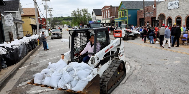 Sandbags are being used to protect the suburban town of Eureka from the Meramec River's rising floodwaters.