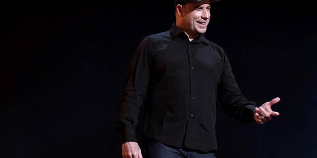 John Travolta is seen onstage during rehearsals for the 86th Academy Awards in Los Angeles, Saturday, March 1, 2014. The Academy Awards will be held at the Dolby Theatre on Sunday, March 2. (Photo by Matt Sayles/Invision/AP)