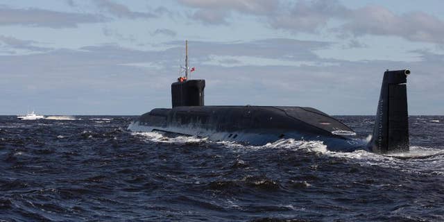 FILE - in this file photo taken on Thursday, July 2, 2009, the Russian nuclear submarine, Yuri Dolgoruky, is seen during sea trials near Arkhangelsk, Russia. The Russian navy said in a statement Friday March 31, 2017, that its submarines have increased combat patrols to the level last seen during the Cold War. (AP Photo/Alexander Zemlianichenko, File)