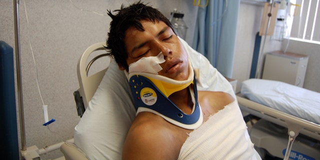 Aug. 24, 2010: Luis Fredy Lala Pomavilla of Ecuador rests at a hospital in eastern Mexico after surviving a drug cartel massacre that killed 72 Central and South American migrants.