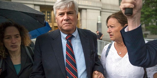 Dean Skelos, center, leaves federal court, Tuesday, July 17, 2018, in New York City. The former New York state Senate leader and his son Adam were convicted on Tuesday of extortion, wire fraud and bribery charges of pressuring businesses to give the son no-show jobs or else risk losing the powerful Republican's political support.