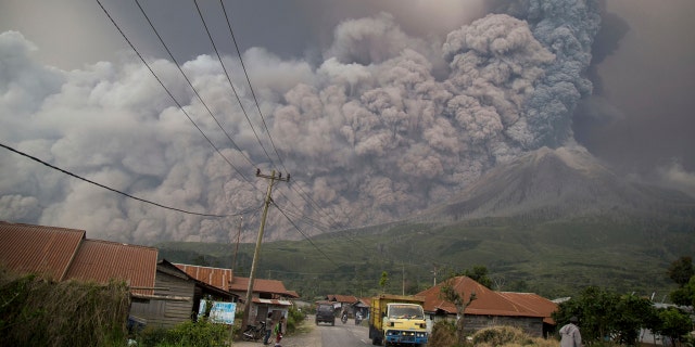 Mount Sinabung spews volcanic ash as it erupts in Kutarakyat, North Sumatra, Indonesia, Monday, Feb. 19, 2018.