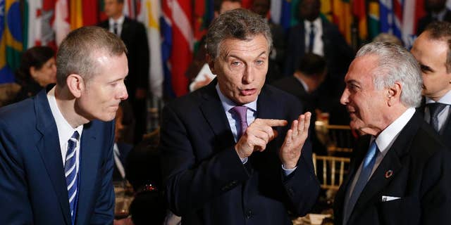 Argentina's President Mauricio Macri, center, speaks with Brazil's President Michel Temer, right, as they arrive for a luncheon during the United Nations General Assembly at United Nations headquarters Tuesday, Sept. 20, 2016. (Lucas Jackson/Pool Photo via AP)