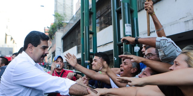 President Maduro during a transport workers rally in Caracas, Venezuela, Tuesday, Nov. 12, 2013.