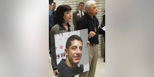 FILE- In this April 9, 2016 file photo, Rich Leotta, the father of police officer Noah Leotta who died after being hit by a suspected drunk driver while on duty last year, addresses Maryland lawmakers in Annapolis, Md. The face of Noah Leotta will appear on ignition interlock devices installed in the vehicles of Maryland motorists convicted of a DUI. (AP Photo/Brian Witte, File)