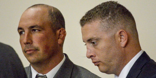 Former Albuquerque Detective Keith Sandy, left, and Officer Dominique Perez on Aug. 18, 2015.