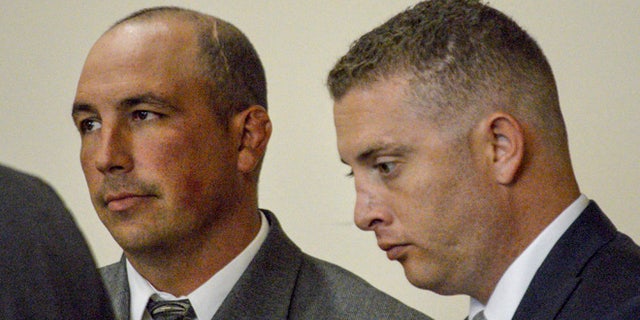 Former Albuquerque Detective Keith Sandy, left, and Officer Dominique Perez on Aug. 18, 2015.