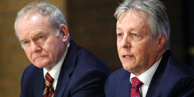 FILE - This is a Friday, Dec. 5, 2014 file photo of Northern Ireland deputy First Minister Martin McGuinness, left, and Northern Ireland First Minister Peter Robinson attend a press conference at The Royal School Armagh, Northern Ireland. Government officials say the prime ministers of Britain and Ireland, David Cameron and Enda Kenny, will travel to Belfast later this week in hopes of forging an agreement to sustain Northern Ireland’s fraying unity government. The planned arrival of both leaders Thursday Dec. 11, 2014 signals increased concern that the 7 ½-year-old coalition of British Protestants and Irish Catholics, a key peacemaking achievement, could collapse without a new compromise pact at their Stormont government headquarters in east Belfast. (AP Photo/Peter Morrison, File)
