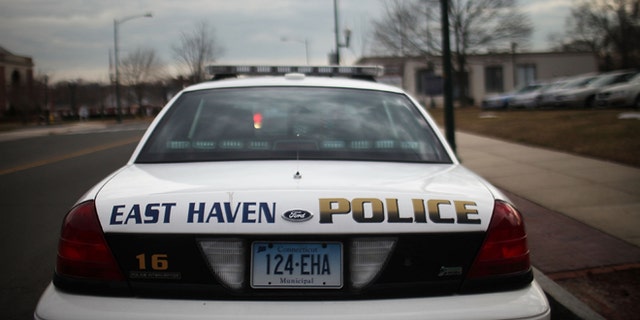 EAST HAVEN, CT - FEBRUARY 01:  An East Haven Police car is viewed on February 1, 2012 in East Haven, Connecticut. Following an investigation by the FBI, four East Haven police officers were arrested last week and accused of abusing Latinos in the working class community of 28,000 people which was nearly predominately white a generation ago. A recent civil rights investigation which was released last month revealed a pattern of discriminatory policing East Haven and the town has been warned by the U.S. Justice Department to make reforms. The arrested officers have been accused of subjecting Hispanics to beatings and false arrests among other things. Currently East Haven's Latino population is around 10 percent.  (Photo by Spencer Platt/Getty Images)