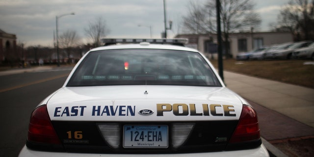 EAST HAVEN, CT - FEBRUARY 01: An East Haven Police car is viewed on February 1, 2012 in East Haven, Connecticut. Following an investigation by the FBI, four East Haven police officers were arrested last week and accused of abusing Latinos in the working class community of 28,000 people which was nearly predominately white a generation ago. A recent civil rights investigation which was released last month revealed a pattern of discriminatory policing East Haven and the town has been warned by the U.S. Justice Department to make reforms. The arrested officers have been accused of subjecting Hispanics to beatings and false arrests among other things. Currently East Haven's Latino population is around 10 percent. (Photo by Spencer Platt/Getty Images)