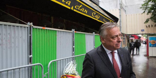 Patrick Dewael, head of the Belgian commission of inquiry, answers the media outside the Bataclan concert hall in Paris, Monday, June 20, 2016. Belgian lawmakers are joining forces with their French counterparts in examining the Islamic State cell that carried out deadly attacks in both Brussels and Paris. (AP Photo/Kamil Zihnioglu)