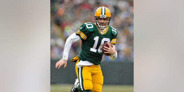 In this Jan. 1, 2012, photo, Green Bay Packers' Matt Flynn scrambles during an NFL football game against the Detroit Lions in Green Bay, Wis. With quarterback Aaron Rodgers hurt, Flynn will back up one-time practice squad player Scott Tolzien, who replaced Seneca Wallace in the 27-13 loss Sunday, Nov. 10, to the Eagles. (AP Photo/Mike Roemer)
