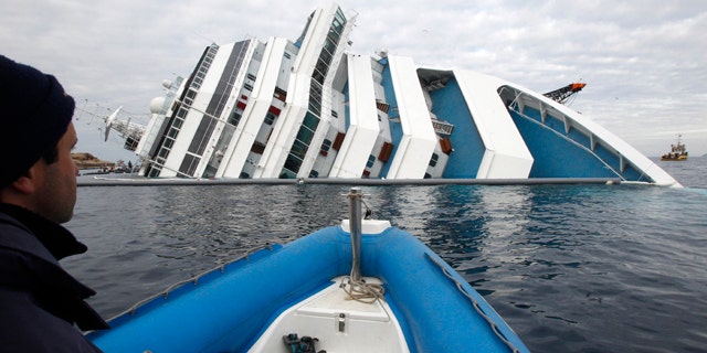 Jan. 27: Italian firefighters approach the grounded cruise ship Costa Concordia off the Tuscan island of Giglio, Italy.