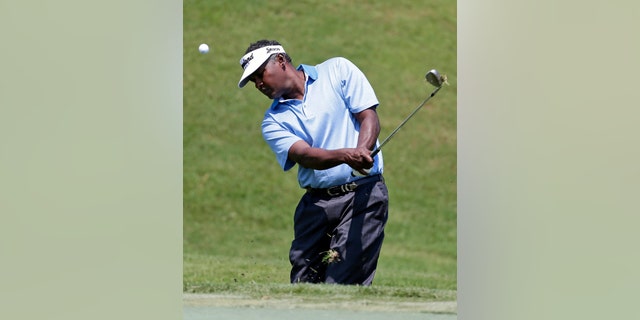 Vijay Singh, from Fiji, chips onto the second green during the first round of The Players championship golf tournament at TPC Sawgrass, Thursday, May 9, 2013, in Ponte Vedra Beach, Fla. (AP Photo/Chris O'Meara)