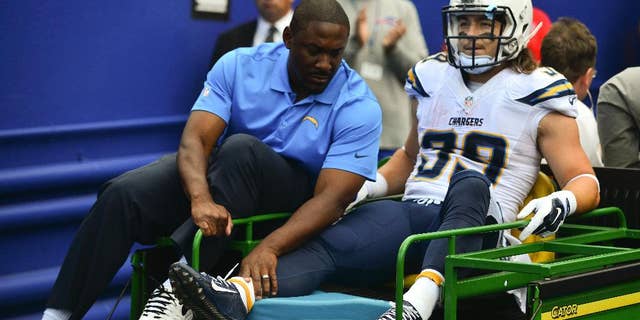 San Diego Chargers running back Danny Woodhead (39) is carted off the field after being injured on a play during the first half of an NFL football game against the Buffalo Bills, Sunday, Sept. 21, 2014, in Orchard Park, N.Y. (AP Photo/Gary Wiepert)