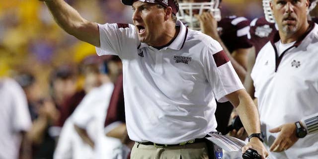 Mississippi State head coach Dan Mullen calls out from the sideline in the second half of an NCAA college football game in Baton Rouge, La., Saturday, Sept. 20, 2014. Mississippi State won 34-29. (AP Photo/Gerald Herbert)