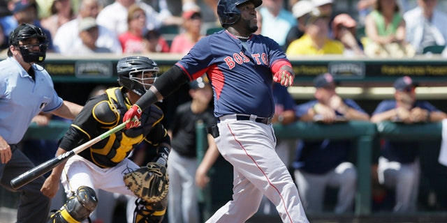 Boston Red Sox designated hitter David Ortiz watches his three-run home run clear the center field wall during the third inning of a spring training exhibition baseball game against the Pittsburgh Pirates in Bradenton, Fla., Thursday, March 12, 2015. The Red Sox defeated the Pirates 5-1. (AP Photo/Carlos Osorio)