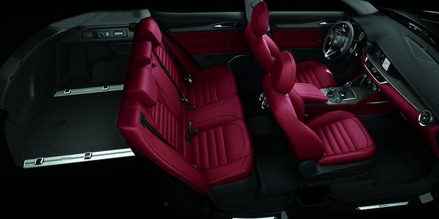 The Stelvio's cabin is sports car cool.