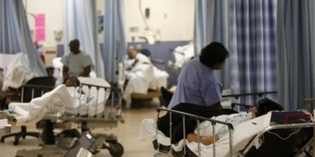 Patients are cared for at the emergency room at Jamaica Hospital is seen in New York, Monday, March 22, 2010. (AP Photo/Seth Wenig)