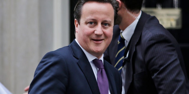 Britain's Prime Minister David Cameron leaves his official residence at 10 Downing Street in central London, on his way to the Houses of Parliament to address lawmakers, Wednesday, Jan. 30, 2013. Cameron will travel to Algeria for bilateral meetings Wednesday in wake of the hostage crisis at a natural gas plant in the north African country.The Jan. 16 attack on Algeria's Ain Amenas gas plant ignited a four-day siege with Algerian forces in which at least 37 hostages and 29 militants were killed. Three Britons are confirmed to have died in the attack, and another three are believed dead. (AP Photo/Lefteris Pitarakis)