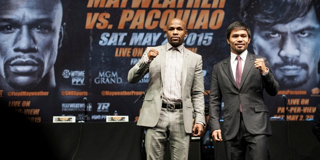 Mayweather and Pacquiao after a news conference Wednesday, March 11, 2015, in Los Angeles.