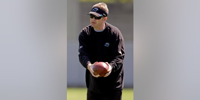 FILE - In this June 7, 2012, file photo, Carolina Panthers offensive coordinator Rob Chudzinski instructs players during an NFL football practice in Charlotte, N.C. A person familiar with the decision said Thursday, Jan. 10, 2013, that the Cleveland Browns have hired Chudzinski as their new coach. (AP Photo/Chuck Burton, File)