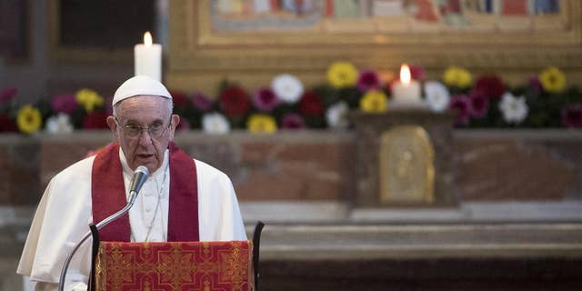 Pope Francis speaks in the Basilica of St. Bartholomew in Rome, Saturday, April 22, 2017, as he celebrates the Liturgy of the Word in memory of the martyrs of the 20th and 21st centuries. (Maurizio Brambatti/Pool photo via AP)