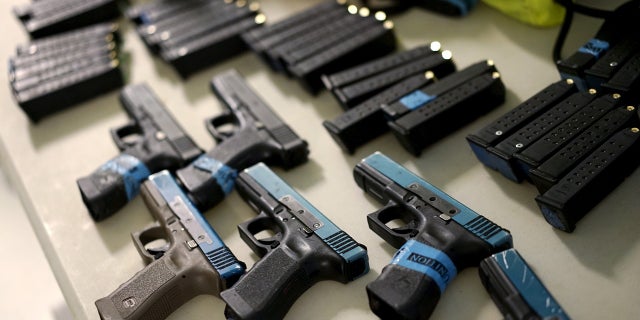 Some Glock semi-automatic pistols and non-lethal training ammunition are seen in Denver, April 2, 2016.